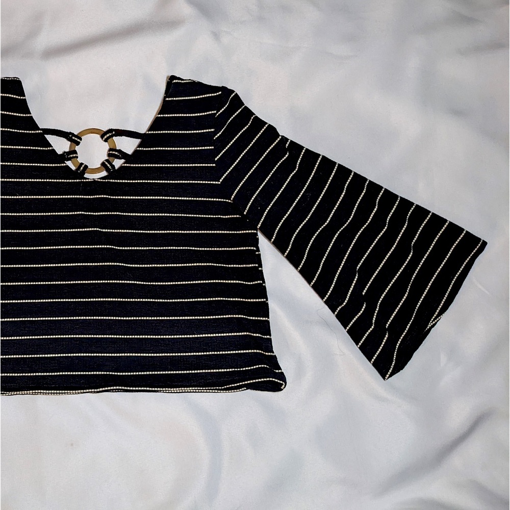 quarter sleeve and cropped top with decorative back